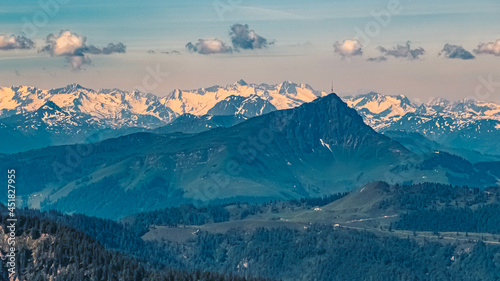 Beautiful alpine summer view with the Kitzbueheler Horn summit and the Hohe Tauern mountains in the background at the famous Steinplatte summit, Waidring, Tyrol, Austria