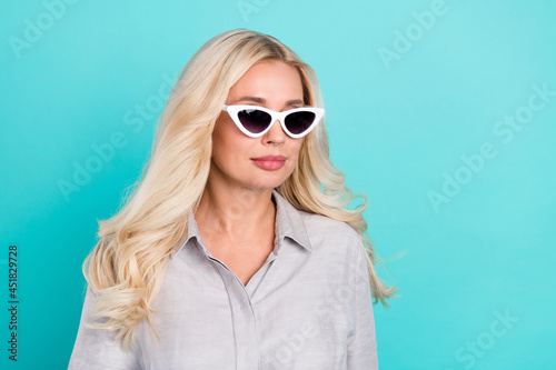 Profile photo of calm tourist traveler lady look empty space wear sunglass grey shirt isolated teal color background