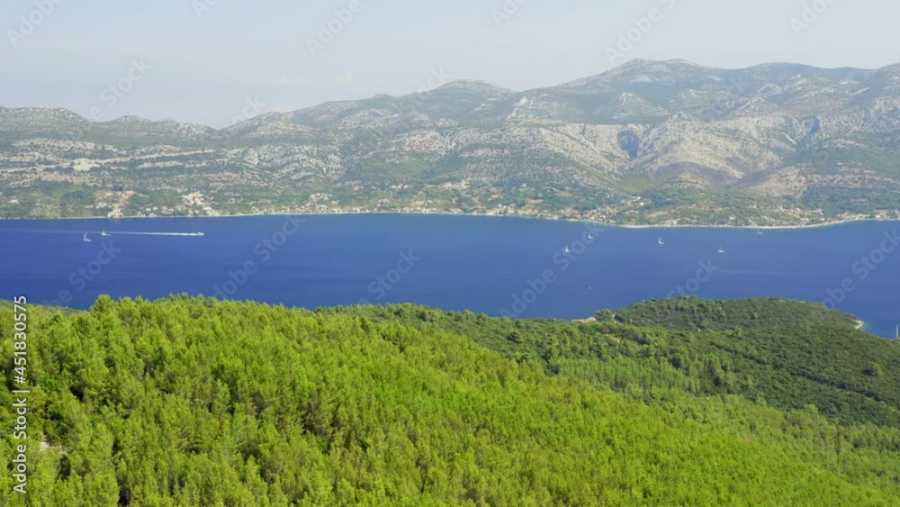 Aerial view of the forested interior of Korcula island and distant coastline of Peljesac peninsula, Adriatic Sea, Croatia Aerial view of the forested interior of Korcula island and distant coastline of Peljesac peninsula, Adriatic Sea, Croatia