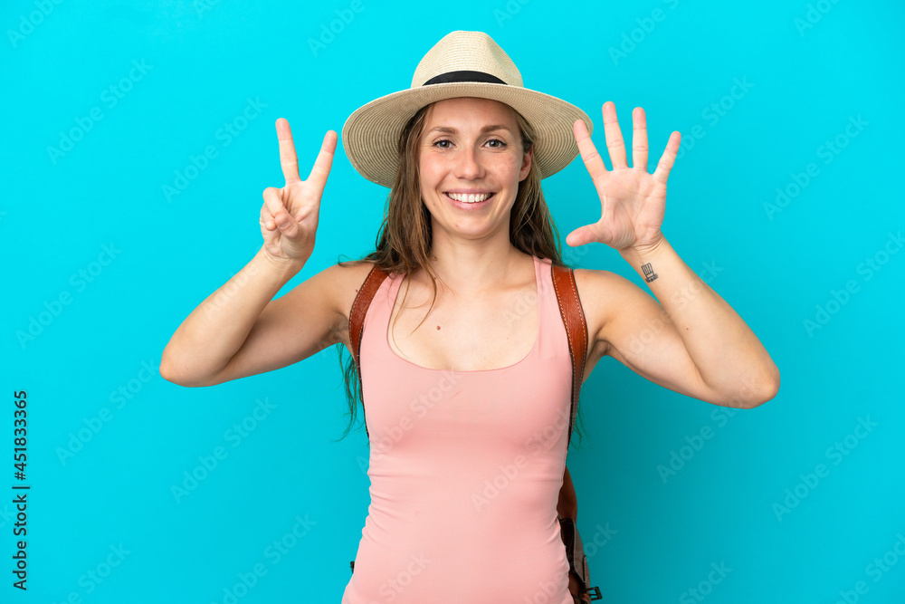 Young caucasian woman in summer holidays isolated on blue background counting seven with fingers Young caucasian woman in summer holidays isolated on blue background counting seven with fingers