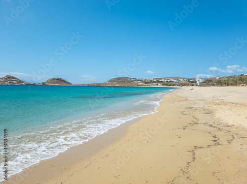 Sandy beach calm sea at Mykonos island, Cyclades Greece. Space, card, advertisement template. photo