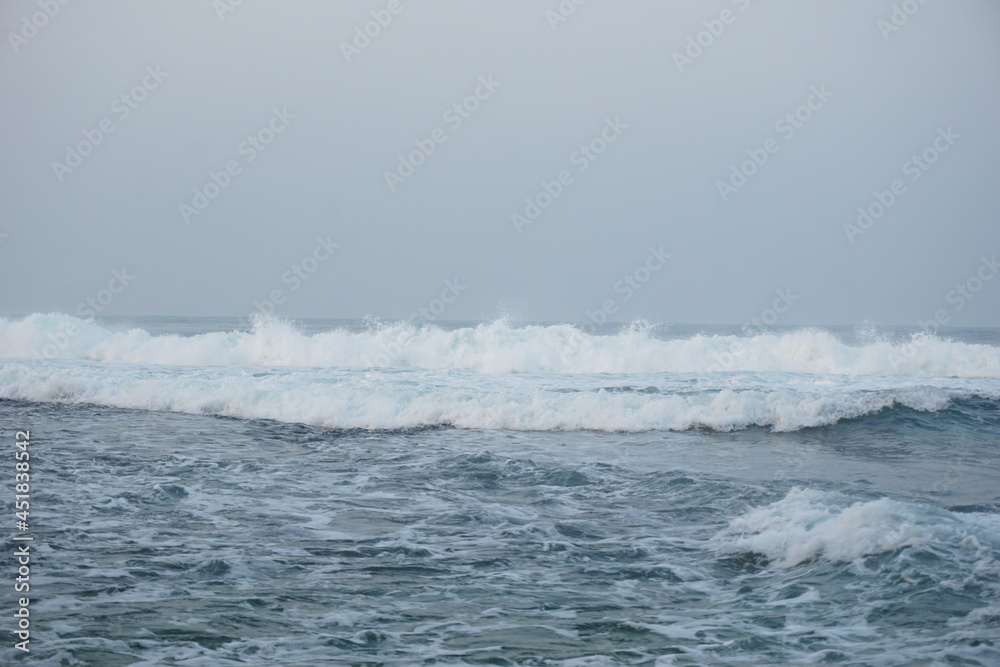 Mesra beach with a natural background. Mesra means intimate. Mesra beach also known as kukup beach or ngrawe beach Mesra beach with a natural background. Mesra means intimate. Mesra beach also known as kukup beach or ngrawe beach