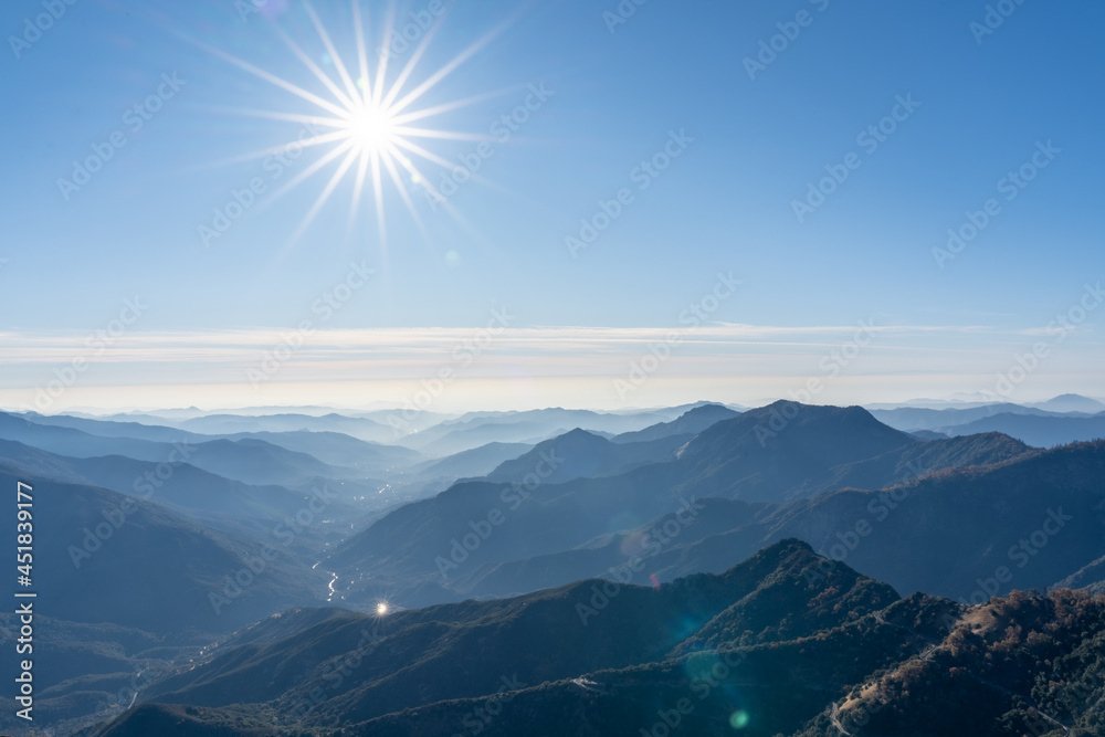 The sun bursts over the Sierra Nevada mountain range of southern California.
