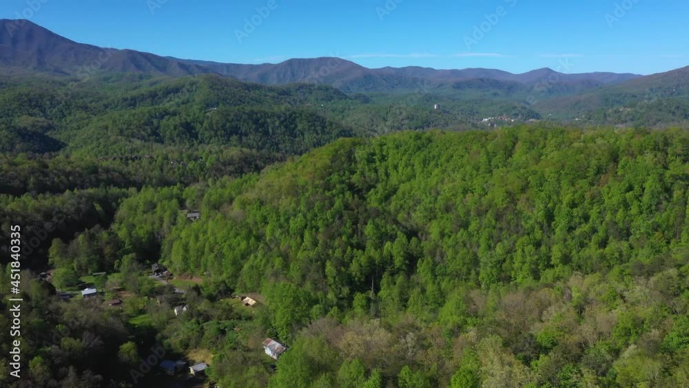 Aerial view of a Tennessee mountain ranges with cabins scattered around the forest Aerial view of a Tennessee mountain ranges with cabins scattered around the forest