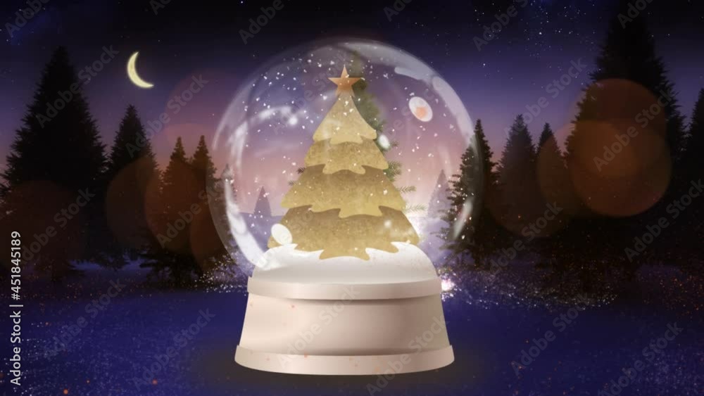 Animation of gold christmas tree in snow globe, with glowing light trails, in forest at night