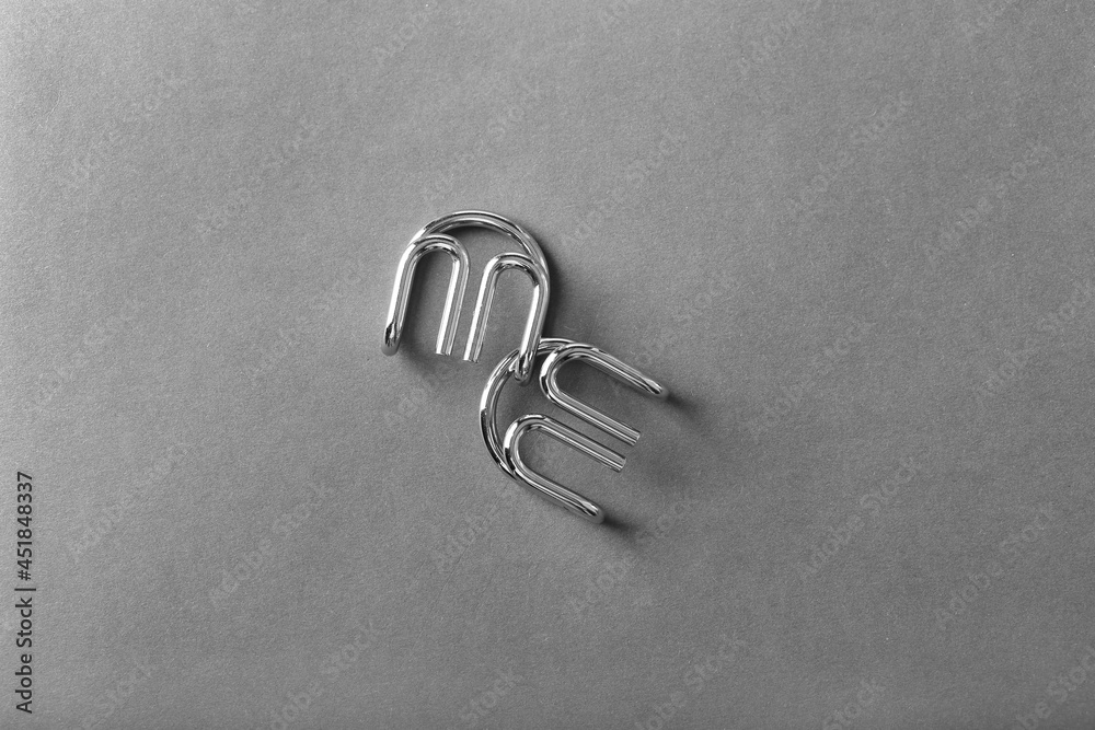 The Wire puzzle (Puzzle ring) on a grey background The Wire puzzle (Puzzle ring) on a grey background