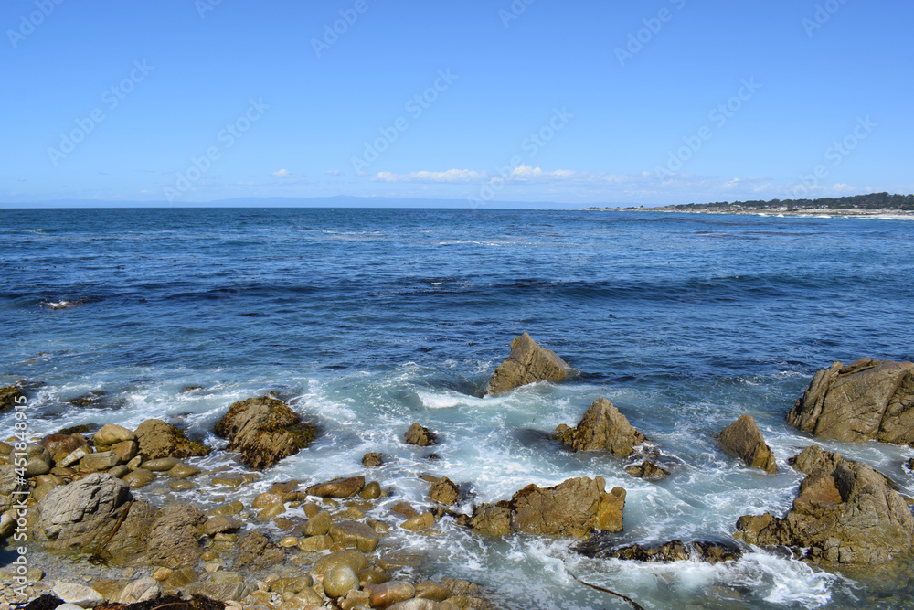 The ocean meeting the rocky shore at 17 Mile Drive in Monterey, California. The ocean meeting the rocky shore at 17 Mile Drive in Monterey, California.