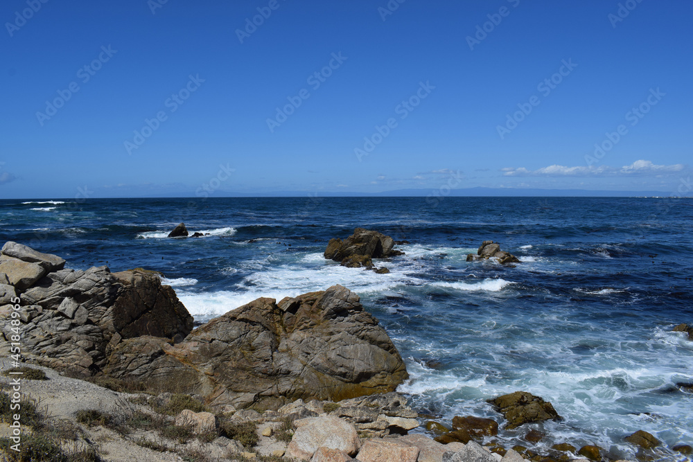 The ocean meeting the rocky shore at 17 Mile Drive in Monterey, California.