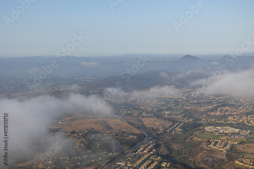 Aerial view over the cloud of Carmel Valley with suburban neighborhood San Diego  California  USA. 