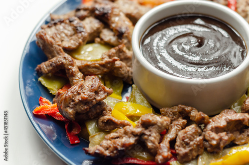 Beef strips with mixed peppers and mangetout served with black bean sauce