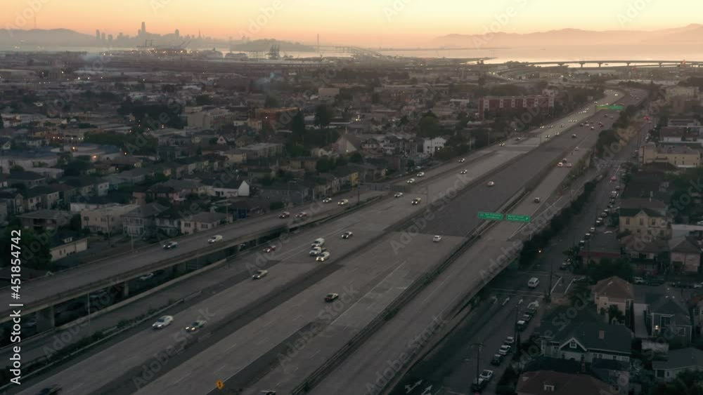 Aerial: Oakland City and Freeway Traffic at sunset. California, USA Aerial: Oakland City and Freeway Traffic at sunset. California, USA