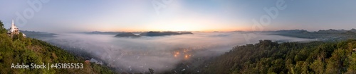 Fog covers the city of Lamphun, Thailand, view from the viewpoint of Wat Phra That Pha Nam
