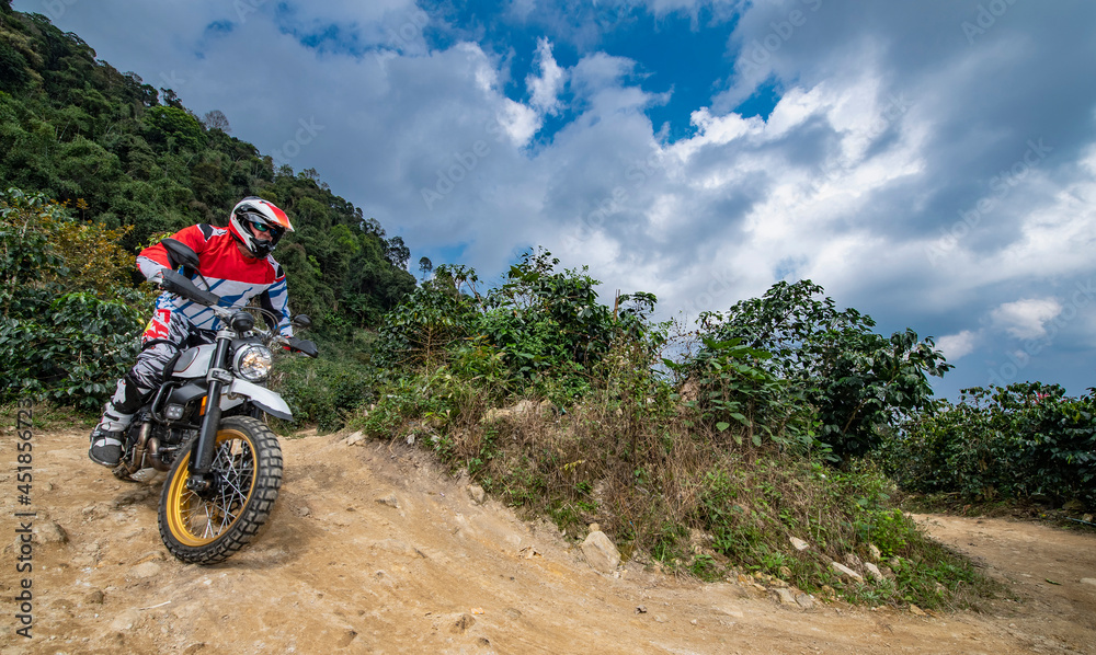 senior adult riding his dirt bike in the hills around Chiang Mai senior adult riding his dirt bike in the hills around Chiang Mai