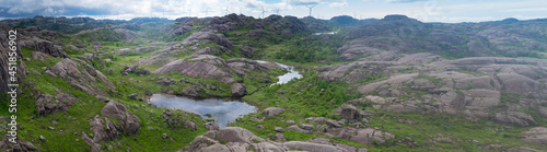 Trollpikken hike in Europe (Norway) with Windmills over rural mountains in  - Green Future concept photo