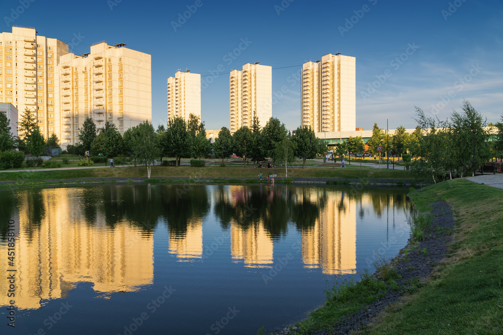 Summer sunset view of Yuzhnoe Butovo park in South Butovo district, Moscow, Russia.