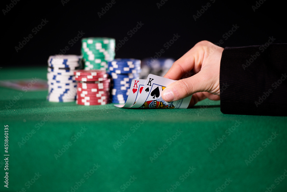 Close-up of hands with pair of kings in poker Close-up of hands with pair of kings in poker