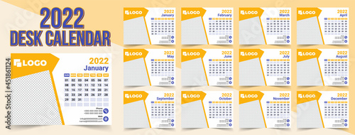 Creative Clean Red Color 2022 Desk Calendar Design Template,Week starts on Sun. Set of 12 calendar pages vector design print template with place for photo and company logo. Desk calendar template