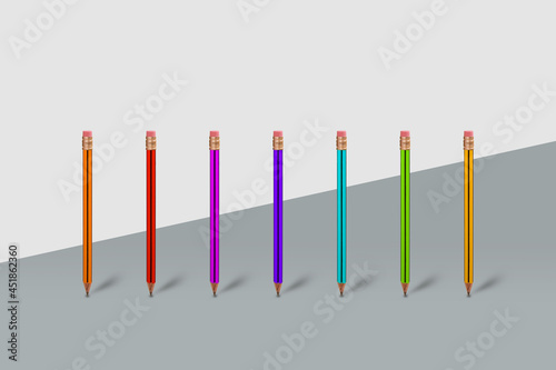 Modern and creative idea made of pencils in different colors on gray background.