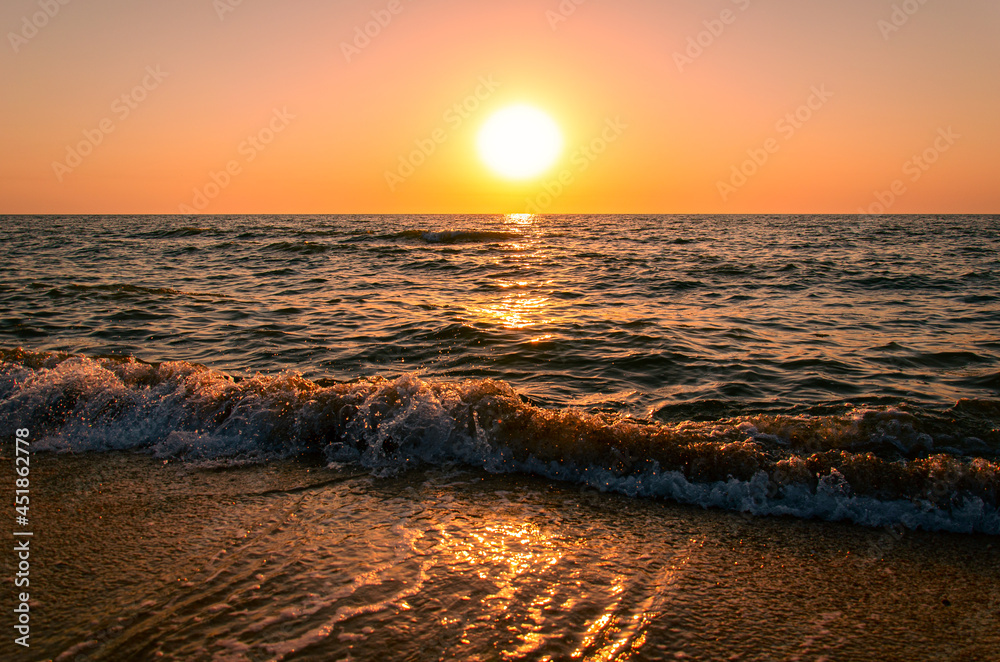 Sunrise over the sea. Beautiful seascape in morning sunlight.