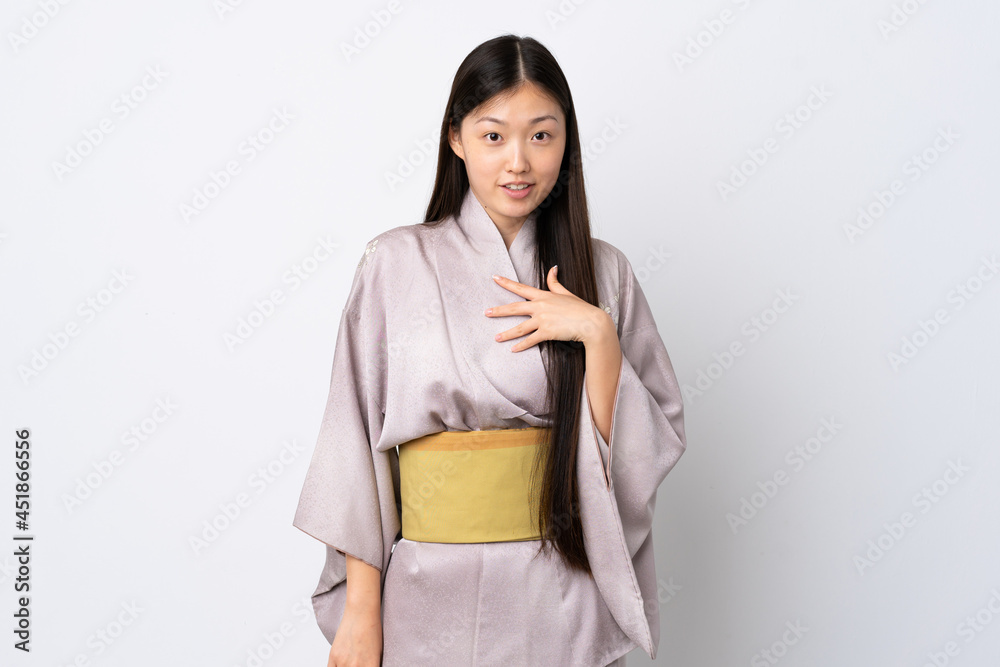 Young Chinese girl wearing kimono over isolated background pointing to oneself Young Chinese girl wearing kimono over isolated background pointing to oneself