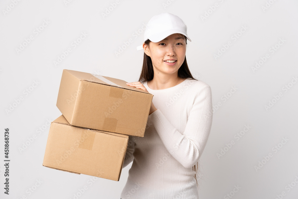 Young delivery Chinese woman over isolated white background applauding