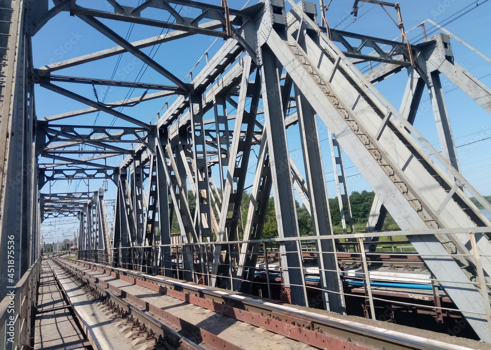 Metal steel bridge construction, sunny day. 