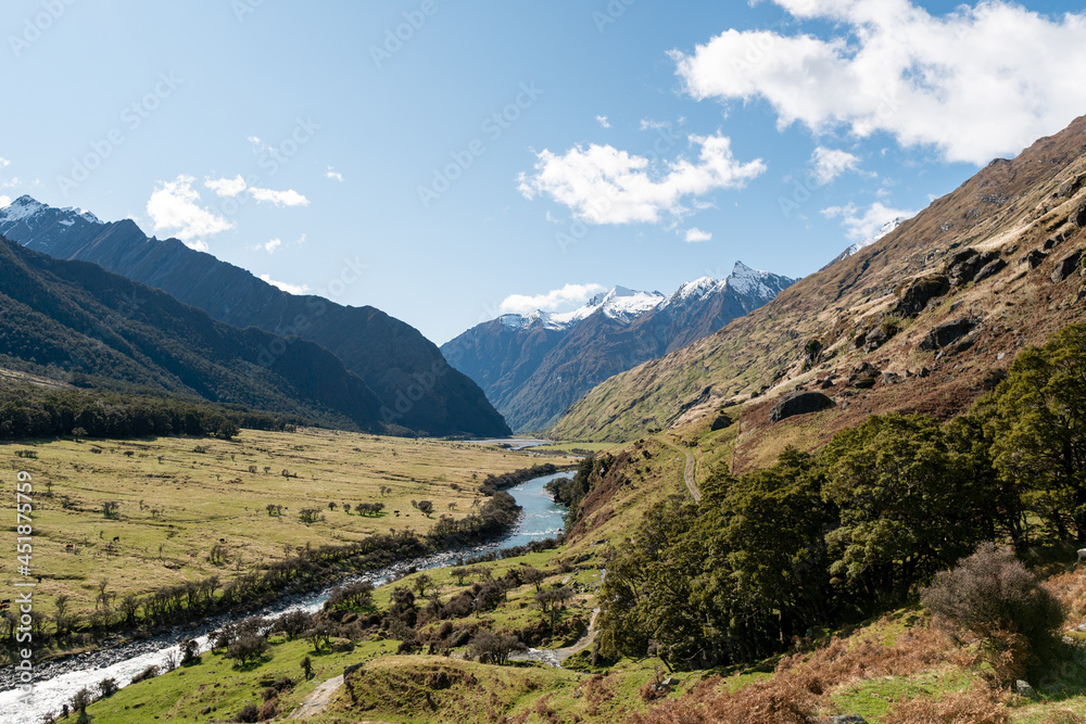 View of Matukituki Valley, Mount Aspiring National Park. Traveling, Hiking and Camping in New Zealand. Snow caped mountains and Green Valleys