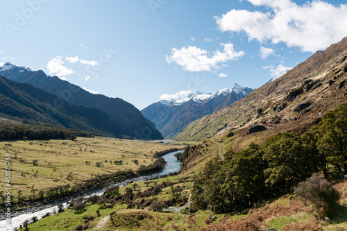 View of Matukituki Valley  Mount Aspiring National Park. Traveling  Hiking and Camping in New Zealand. Snow caped mountains and Green Valleys