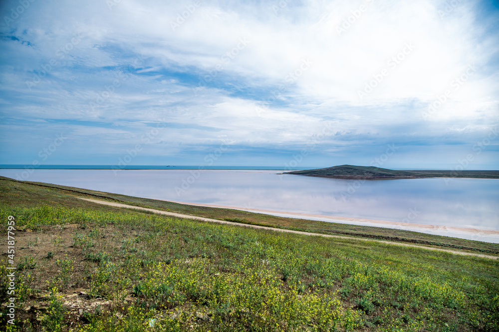 Lake Koyashskoye. A pink-orange lake in the foreground