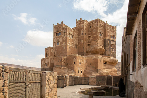 Dar al-Hajar in Wadi Dhahr, a royal palace on a rock. one of the most iconic Yemeni buildings. traditional Yemeni heritage architecture design details in historic Sanaa town and buildings in Yemen. photo