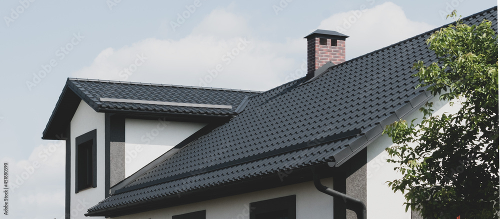 The roof of the dark color of the new house - obrazy, fototapety, plakaty 