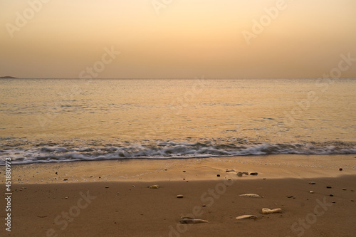 Sandy tropical beach at dawn in Crete.