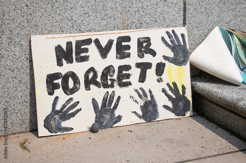 Memorial for Indigenous children which remains have been found near the city of Kamloops in May. A view of sign Never Forget in front of Vancouver Art Gallery