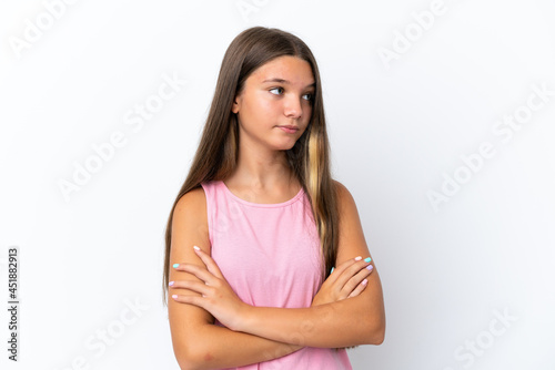 Little caucasian girl isolated on white background keeping the arms crossed