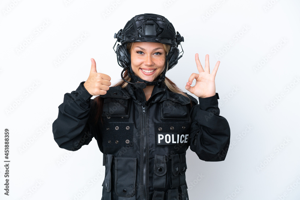 SWAT Russian woman isolated on white background showing ok sign and thumb up gesture SWAT Russian woman isolated on white background showing ok sign and thumb up gesture