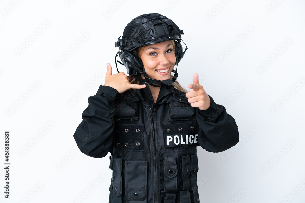 SWAT Russian woman isolated on white background making phone gesture and pointing front SWAT Russian woman isolated on white background making phone gesture and pointing front