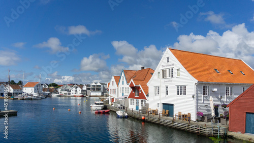 Skudeneshavn, Karmøy, Norway. Seafront White houses and wharves.