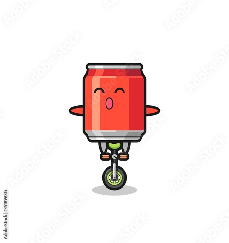 The cute drink can character is riding a circus bike © heriyusuf