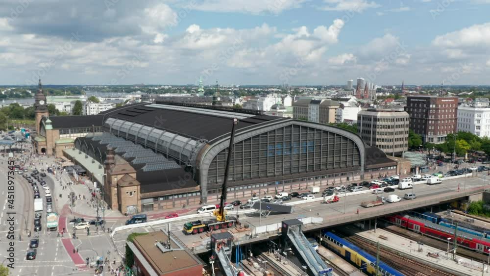 Ascending view of Hamburg Hauptbahnhof historical building. Truck crane operating from bridge over platforms. Free and Hanseatic City of Hamburg, Germany Ascending view of Hamburg Hauptbahnhof historical building. Truck crane operating from bridge over platforms. Free and Hanseatic City of Hamburg, Germany