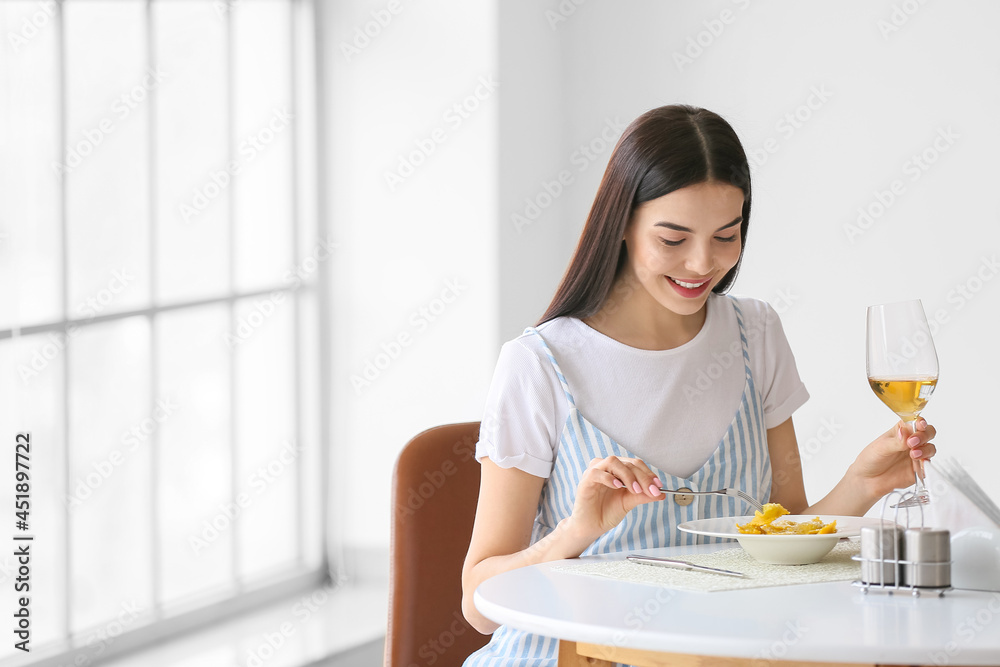 Beautiful young woman eating tasty ravioli in cafe Beautiful young woman eating tasty ravioli in cafe