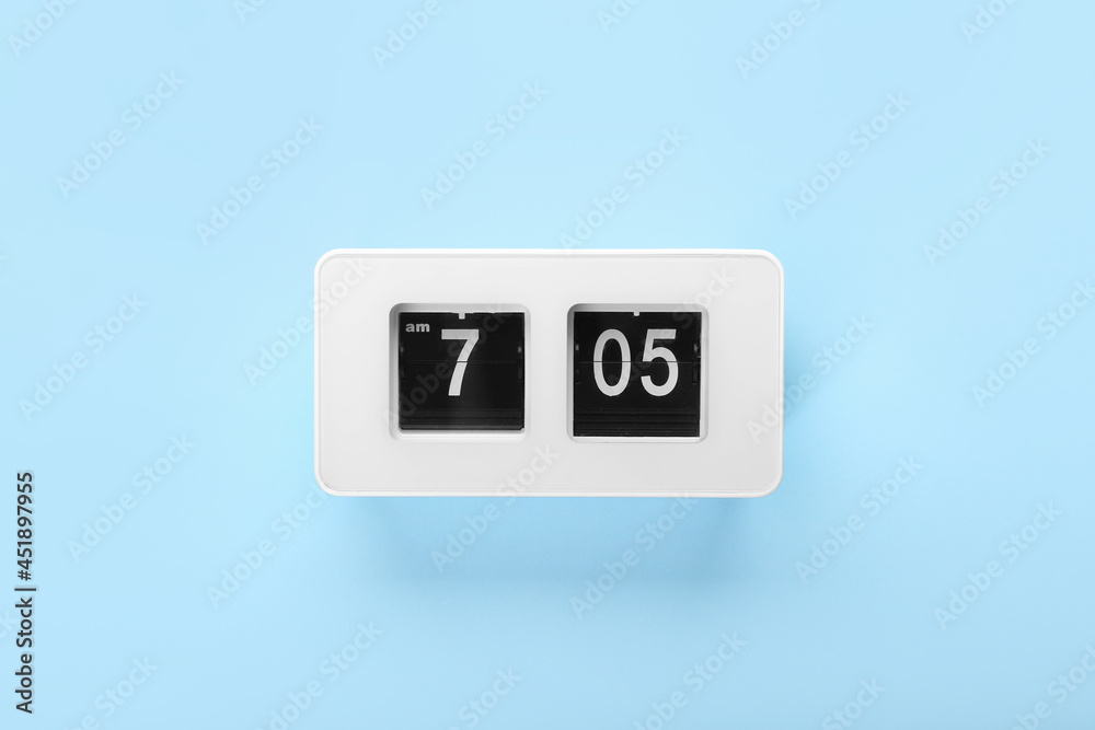 Modern alarm clock on color background Modern alarm clock on color background