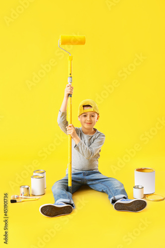 Little boy with roller and ...