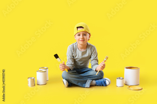 Little boy with brushes and...