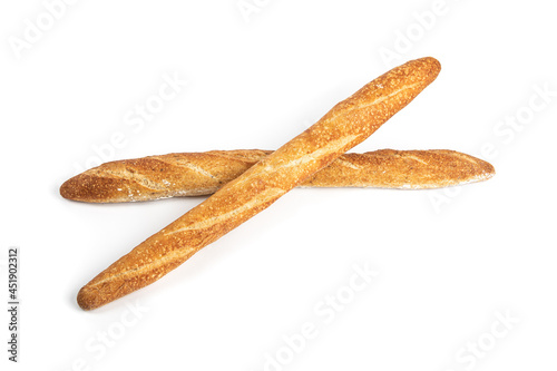 Overhead view of two crossed crusty bread French sticks or baguettes on a white background