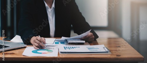 Obraz na plátně Business woman working in finance and accounting Analyze financial budget at hom