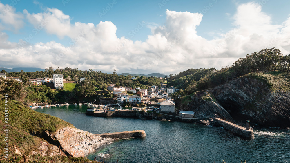 Panoramic view of the village and the port of Viavelez, Asturias, on a sunny day.