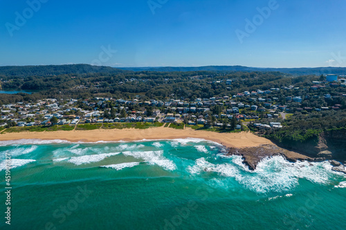 Blue ocean with large waves crashing on to North Avoca Shoreline in  New South Wales Australia