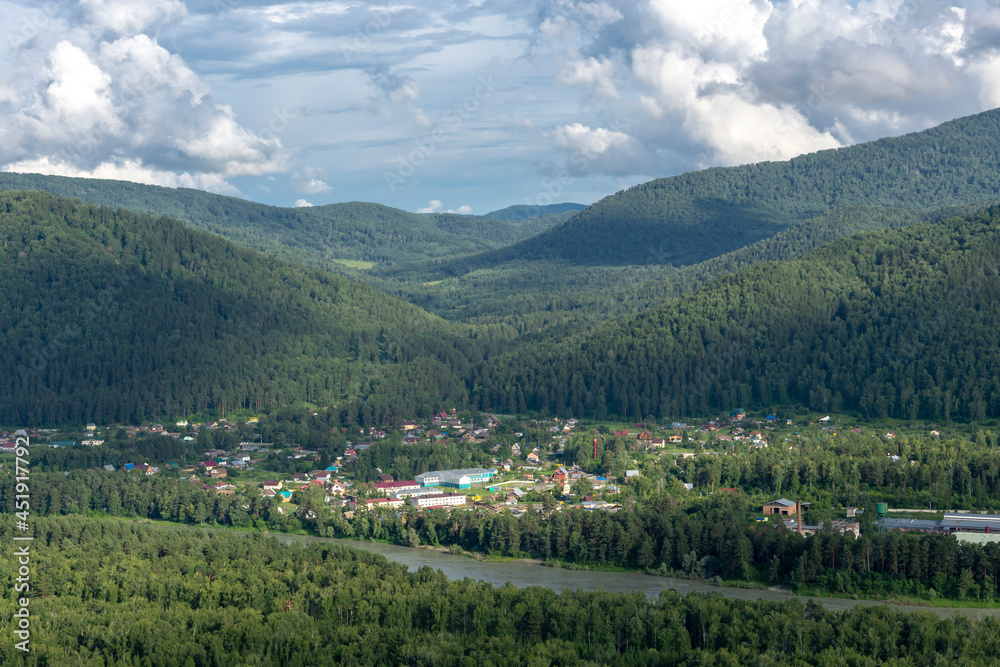 Fototapeta premium white fluffy clouds on blue sky and mountain peaks