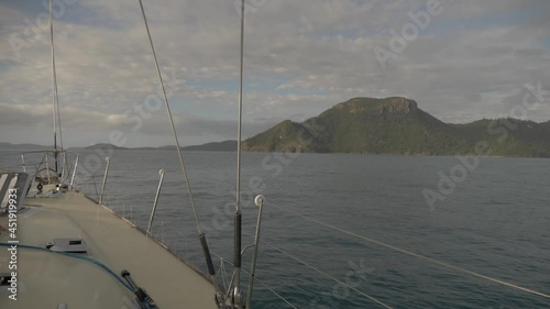 Turnbuckle And Grabrail Of A Sailboat Cruising Across Hook Passage In Whitsundays, QLD, Australia. wide shot photo