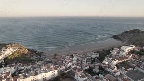 Golden hour at Burgau beach in Portugal with holiday stays closeby photo